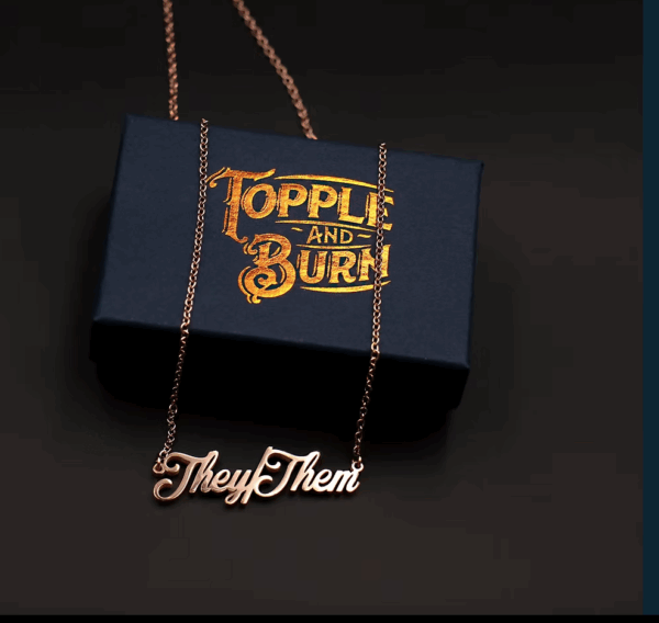 TOPPLE & BURN gold they/them cursive necklace